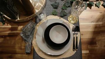 Dinning table set at home, tableware, glasses, spoon and fork. photo