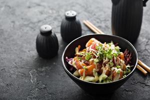 Poke bowl with salmon and vegetables photo