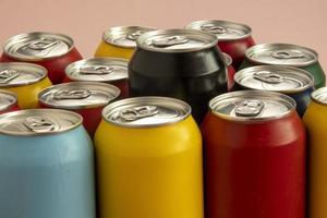 Soda cans for conceptual use representing that of calorie intake and obesity with a black can sticking out of the middle photo