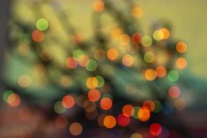 abstract defocused glowing light bulbs background, blur concept. Christmas wallpaper decorations. Festival Holiday Scenery