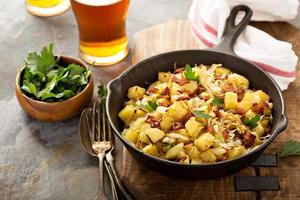 Fall side dish with fried cabbage, potatoes and bacon photo