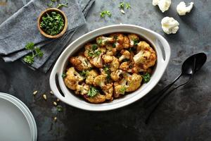 Roasted cauliflower with pine nuts and parsley photo