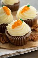 Carrot cupcakes with cream cheese frosting photo