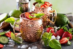 Moscow mule cocktail with lime and strawberry photo