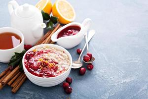 Fall breakfast with oatmeal and cranberry sauce photo