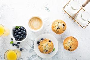 Bright and airy breakfast with blueberry muffin photo