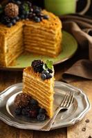 Honey layered cake with berries photo