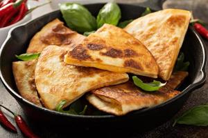 Cheese quesadillas in a cast iron pan photo