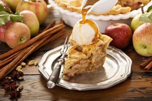Homemade apple pie slice with vanilla ice cream photo