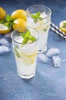 Classic lemonade on blue background photo