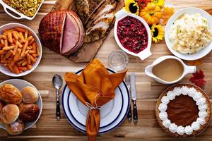 Thanksgiving table with turkey and sides photo