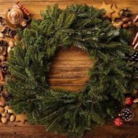 Christmas pine wreath with spices and candy cones photo