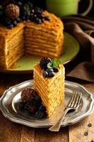 Caramel cake with honey and cream frosting photo