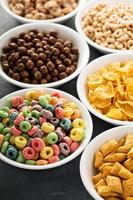 Variety of cold cereals in white bowls photo