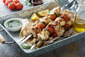 Grilled chicken cabobs on skewers photo