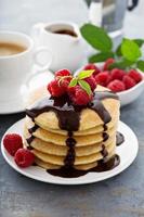 Stack of fluffy buttermilk pancakes with chocolate photo