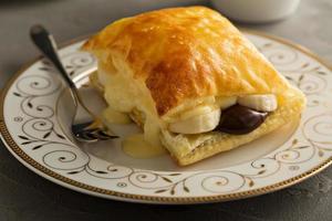 Puff pastry stacks with banana and chocolate photo