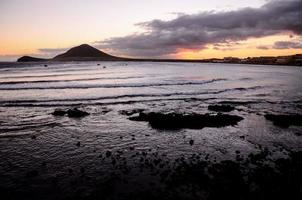 Sunset over the ocean photo