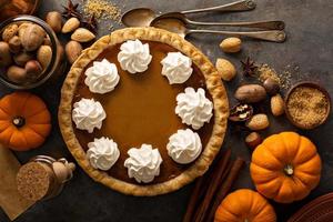 Pumpkin pie with whipped cream photo