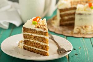 Piece of carrot cake with cream cheese frosting photo