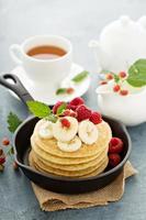 Fluffy buttermilk pancakes with bananas photo