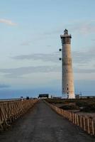 Lighthouse by the sea photo