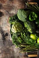 Variety of green vegetables and fruits photo