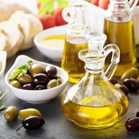 Mediterranean cuisine with olive oil, cheese and bread photo