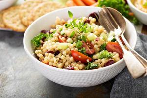 Pearl couscous salad with fresh vegetables photo