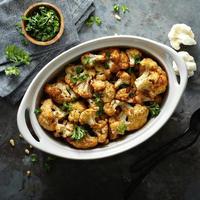 Roasted cauliflower with pine nuts and parsley photo