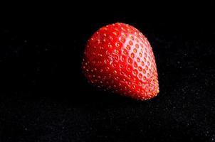 Strawberry on black background photo