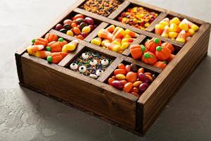 Halloween candy in a wooden box photo