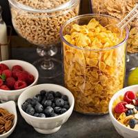 Cereal bar or buffet wih cornflakes, fruit and nuts photo