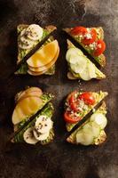 Avocado toast with various toppings photo