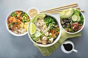 Variety of poke bowls with tuna, salmon and tofu photo