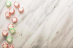 Holiday background with peppermint candy photo