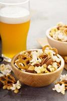 Homemade salty trail mix with beer photo