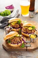 Pulled pork sandwiches with cabbage and pickles photo