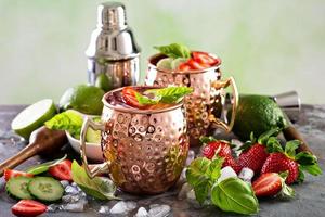 Moscow mule cocktail with lime and strawberry photo