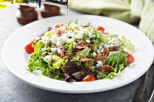 Green salad with blue cheese and bacon photo