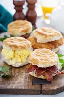 Breakfast biscuits with soft scrambled eggs and bacon photo