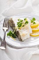 Grilled stripped bass with lemon and herbs photo