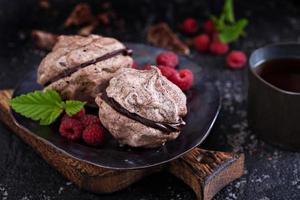 Meringue dessert with chocolate and raspberries photo