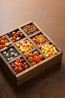 Halloween candy in a wooden box photo