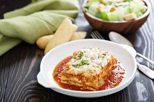 Traditional lasagna on white plate photo