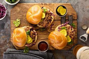 Pulled pork sandwiches with cabbage and pickles photo