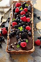 Chocolate ganache tart with fresh berries photo