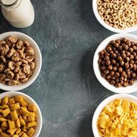Variety of cold cereals in white bowls photo