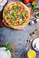 Breakfast pizza with bacon and vegetables photo