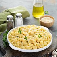 Macaroni and cheese on a white plate photo